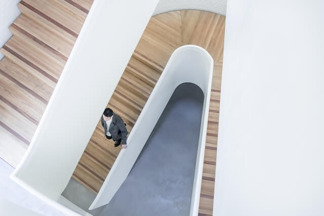 Person stepping down stairs